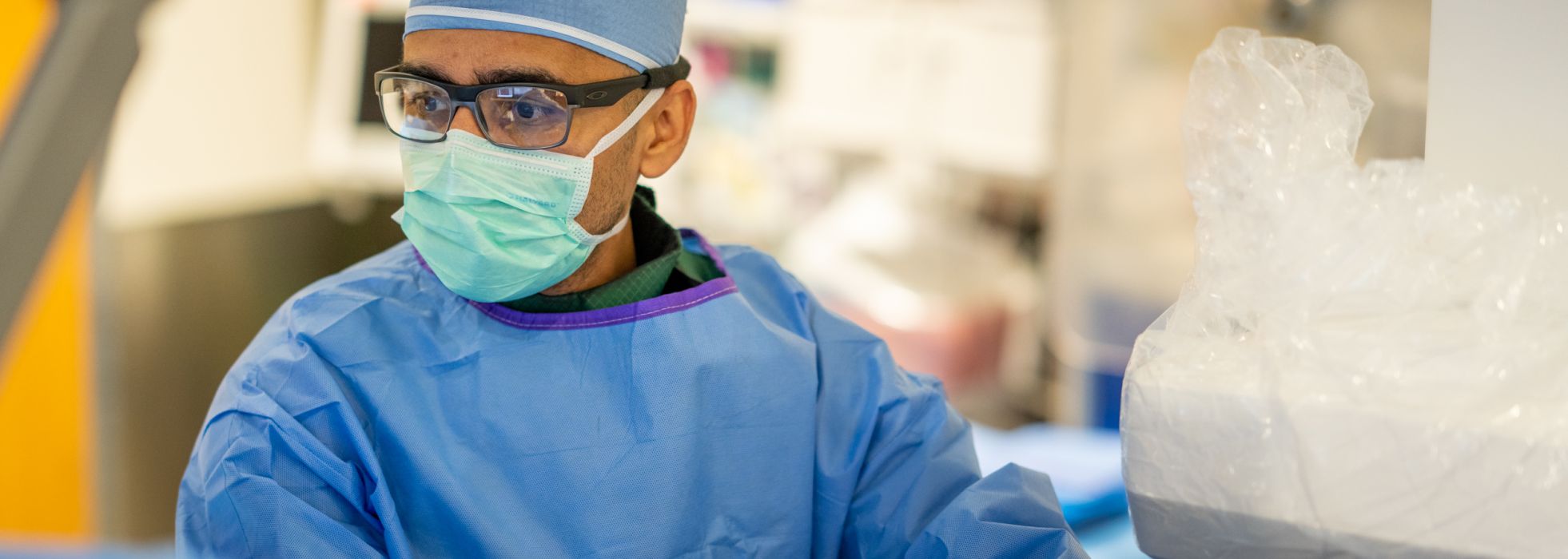 Dr. Farhan Raza working in the cath lab at University Hospital.